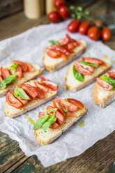 Bruschetta, bread, tomato and olive oil - GIOF03784