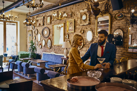 Elegant couple having a drink in a bar stock photo