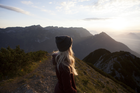 Austria, Tyrol, hiker enjoying the view on Achensee at sunrise stock photo