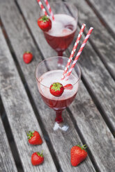 Strawberry lemonade in glasses with drinking straws - GWF05386