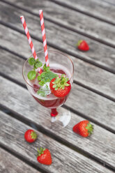 Strawberry lemonade in glass with drinking straws - GWF05388
