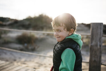 Portrait of a boy grimacing on the beach - JRFF01530