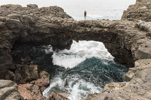 Mauritius, South Coast, Pont Naturel, female tourist on stone bridge stock photo