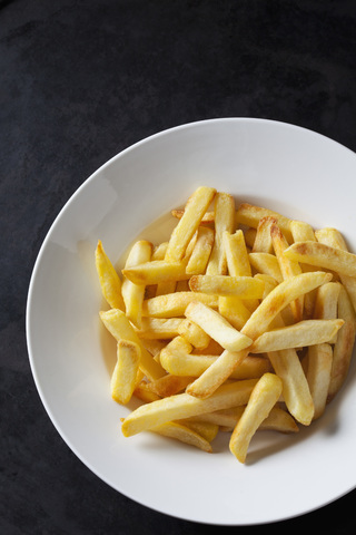 Pommes frites auf dem Teller, lizenzfreies Stockfoto