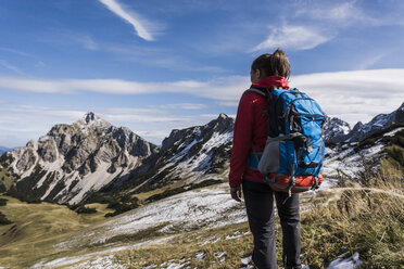 Austria, Tyrol, young woman hiking in the mountains - UUF12551