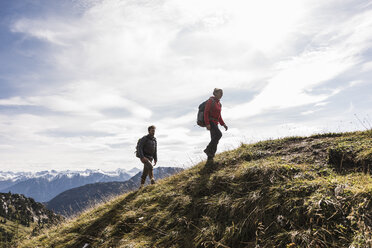 Austria, Tyrol, young couple hiking in the mountains - UUF12556