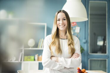 Portrait of happy woman at home - MOEF00708