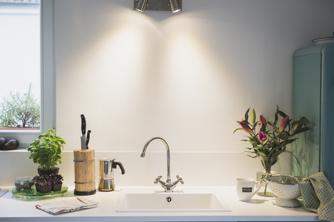 Interior of a kitchen with bunch of flowers stock photo