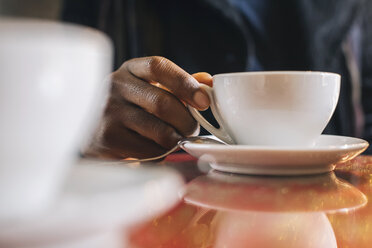 African american man drinking coffee - MAUF01303