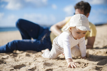 Spain, Lanzarote, baby girl crawling on the beach - DIGF03233