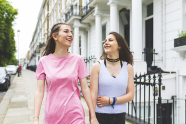 Two happy teenage girls on the go in the city - WPEF00001