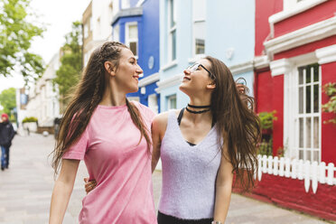 Two happy teenage girls on the go in the city - WPEF00014