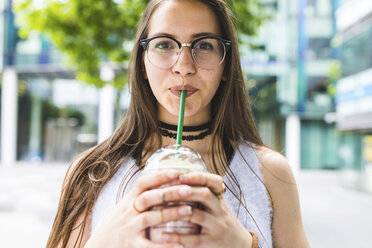 Portrait of teenage girl drinking milkshake - WPEF00029