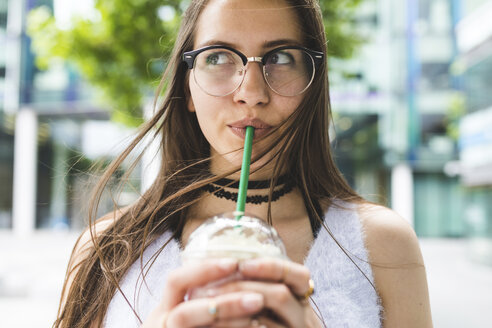Portrait of teenage girl drinking milkshake - WPEF00031