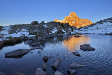 Italy, Trentino, Dolomites, Passo Rolle, Pale di San Martino range, mountain peak Cimon della Pala in the evening light - RUEF01810