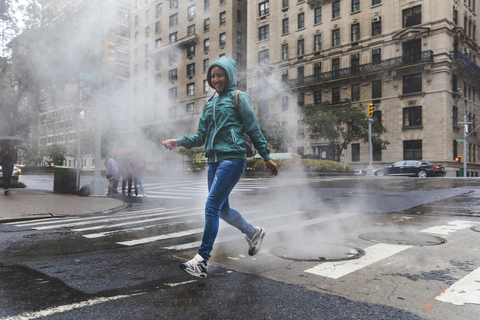 USA, New York, woman in the city on a rainy day stock photo