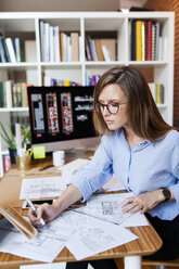 Young woman working in architecture office - VABF01479