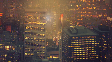 USA, New York, Manhattan, high-rise buildings at night - DAPF00886