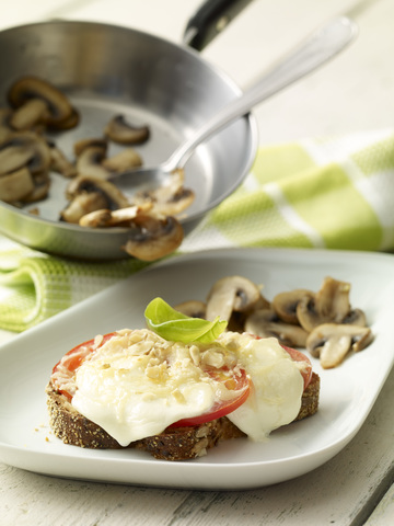 Mozzarella bread and champignons on plate stock photo