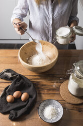 Woman preparing dough at home - MAUF01333