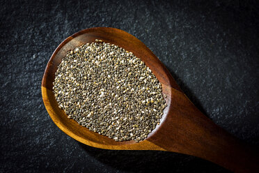 Chia seeds on wooden spoon - MAEF12529