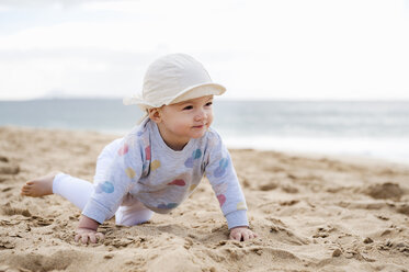 Spain, Lanzarote, baby girl crawling on the beach - DIGF03287