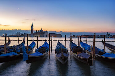 Italy, Veneto, Venice, Gondolas in front of San Giorgio Maggiore, early morning - YRF00202