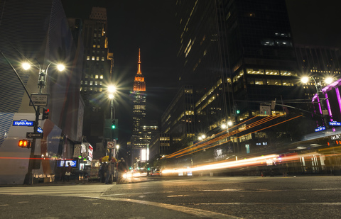 USA, New York City, Eighth Avenue and Empire State Building at night stock photo
