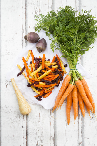 Sweet potato, carrot and parsnip fries stock photo