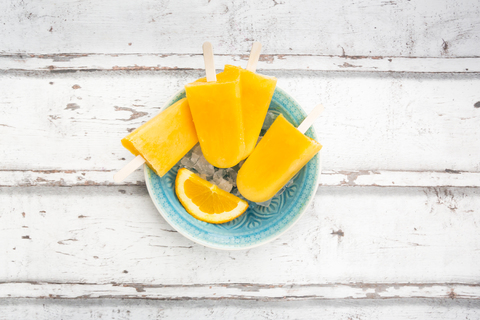 Homemade orange popsicles stock photo