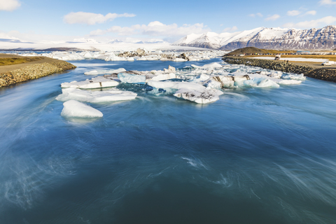 Iceland, Hof, Jokulsarlon lagoon with icebergs and mountains stock photo