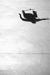 Shadow of person skateboarding in park - FSIF00121