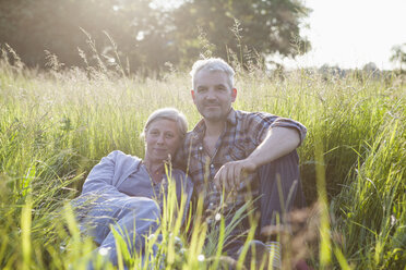 Portrait of confident mature couple taking break from gardening - FSIF00174