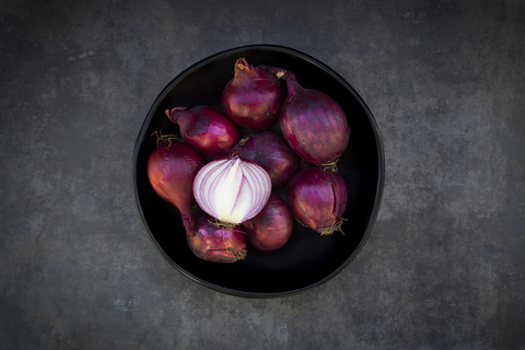 Bowl of red onions stock photo