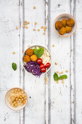 Sweet potato balls, Couscous, Hummus and vegetables in bowls - LVF06689