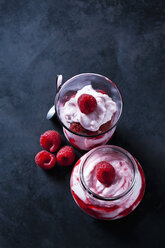 Trifle of whipped cream with strawberries and strawberry sauce in glasses - CSF28924