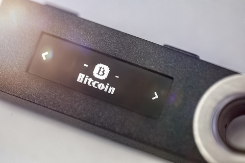 A digital hardware wallet for storing bitcoin, USB stick stock photo