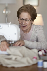 A senior woman sewing - FSIF00429