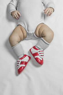 A baby boy wearing baby soccer shoes, waist down - FSIF00692