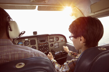Father and son in cockpit of private airplane - FSIF01000