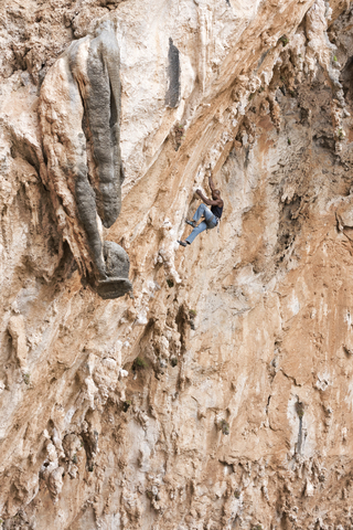 Greece, Kalymnos, climber in rock wall stock photo