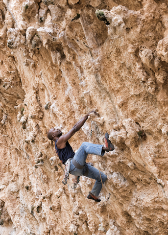 Greece, Kalymnos, climber in rock wall stock photo