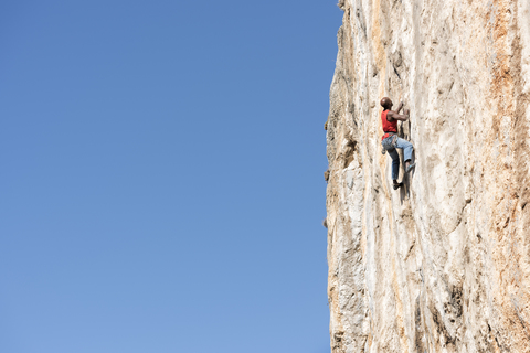 Greece, Kalymnos, climber in rock wall stock photo