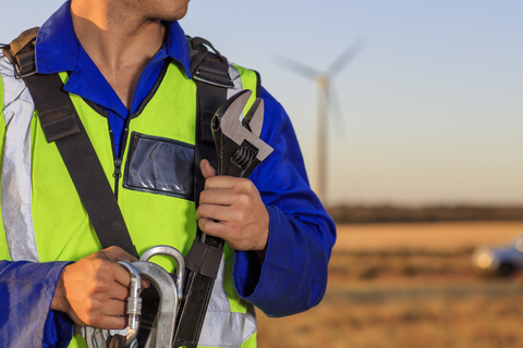 Close-up of technician with equipment on a wind farm stock photo
