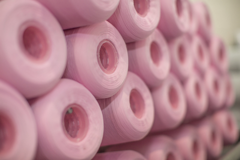 Pink cotton reels stock photo