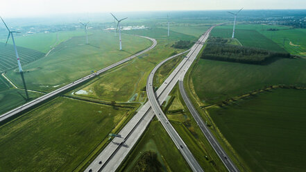 Aerial view of highways by wind turbines on field, Berlin, Brandenburg, Germany - FSIF01357