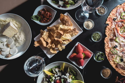 Table with italian food, salads and snacks stock photo