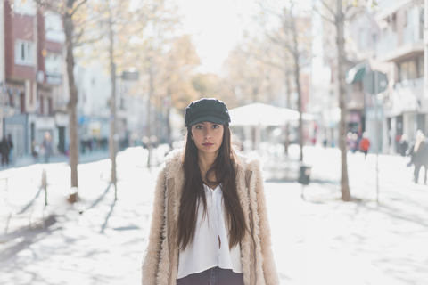 Portrait of stylish young woman in the city stock photo