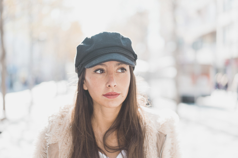 Portrait of stylish young woman in the city stock photo