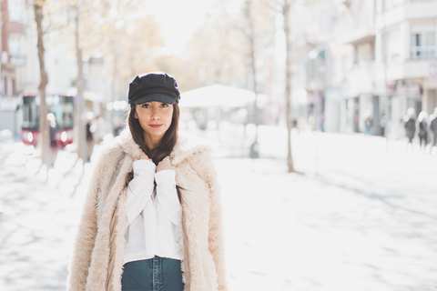 Portrait of stylish young woman in the city stock photo